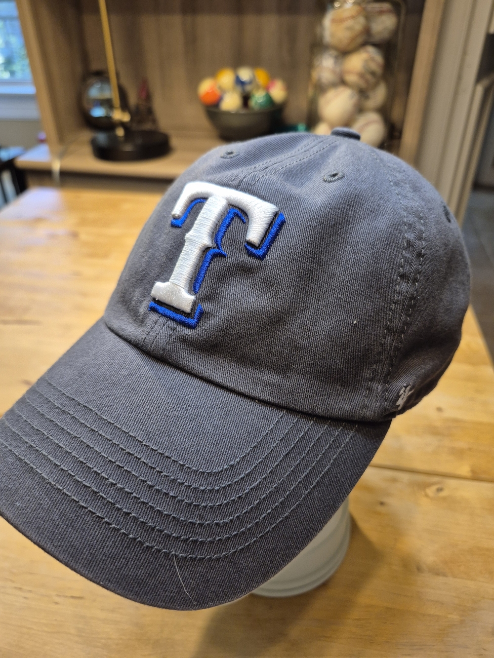 Gray Baseball Cap with White & Blue 'T' Embroidered Logo